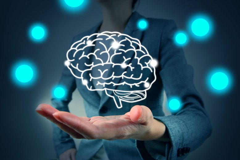 woman hold brain symbol on hand